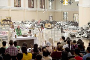 Archbishop of Palo John Bu (right), retired Archbishop of Washington Theodor McCarrick (second left), and former Archbishop of Palo Jose Palma (left) hold Mass in the destroyed cathedral in Palo on Sunday. Grieving survivors of a monster typhoon gathered in shattered churches to listen to soothing sermons. AFP PHOTO