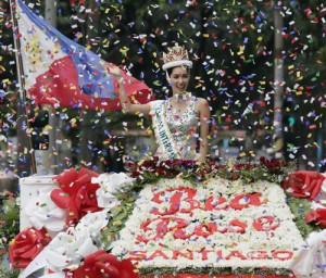 A rain of confetti falls on Bea Rose Santiago, Miss International 2013, at the victory parade held in her honor at the heart of the country’s business center along Ayala Avenue, Makati City on Friday. Photo by Rene Dilan 