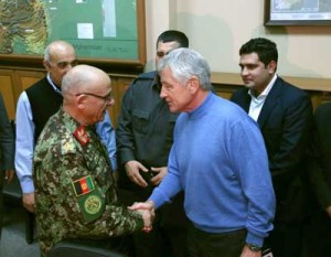 United States Secretary of Defense Chuck Hagel (right) shaking hands with Afghan Gen. Sher Mohammad Karimi during a meeting at the International Security Assistance Force Headquarters on Saturday (Sunday in Manila) in Kabul, Afghanistan. AFP PHOTO