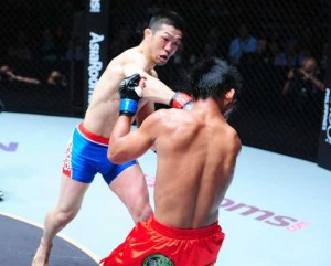 Honorio Banario (in red trunks) absorbs another brutal knock out from Koji Oishi.