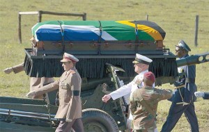 Military officers escort the coffin of former South African president Nelson Mandela during his funeral in Qunu. AFP PHOTO