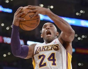 Kobe Bryant No.24 of the Los Angeles Lakers reacts as he grabs a rebound during the first half against the Toronto Raptors at Staples Center in Los Angeles, California. AFP PHOTO