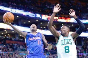 Jamal Crawford No.11 of the Los Angeles Clippers goes up for a layup in front of Jeff Green No.8 of the Boston Celtics in the second half during the game at TD Garden in Boston, Massachusetts. AFP PHOTO