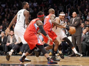 Paul Pierce No.34 of the Brooklyn Nets drives towards the basket while being defended by Jamal Crawford No.11 and Stephen Jackson No.1 of the Los Angeles Clippers during the second half at Barclays Center in the Brooklyn borough of New York City. AFP PHOTO