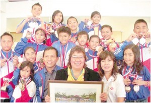 Philippine Swimming League (PSL) President Susan Papa and Secretary General Susan Benasa with the PSL swimmers.  CONTRIBUTED PHOTO