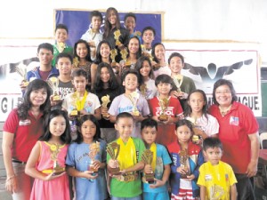 Philippine Swimming League President Susan Papa (far right) and Secretary General Maria Susan Benasa (far left) along with the most outstanding swimmers of the 51st Philippine Swimming League Series. CONTRIBUTED PHOTO 