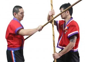 Nicolas (right) executes a vertical block against his opponent’s high line attack.