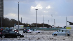 Cars are abandoned as flood waters receed in New Brighton, north west England, on Thursday (Friday in Manila) after high winds and flooding hit the north of England and Scotland.  AFP PHOTO 