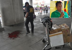 A police investigator looks at the pool of blood at the crime scene. (inset) Mayor Ukol Talumpa PHOTO BY EDWIN MULI