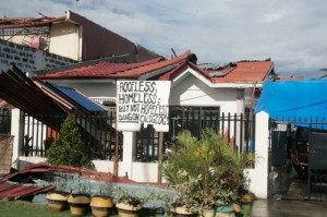 One month after Super Typhoon Yolanda severely damaged large parts of Eastern Visayas leaving more than 6,000 dead, residents are trying their best to resume the lives they led before the tragedy. As the handmade sign in front of the damaged house says, the situation is not helpless. PHOTO BY RENE DILAN 