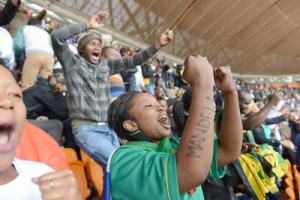 People dance as they enter Soccer City Stadium in Johannesburg to attend the memorial service for Nelson Mandela on December 10. Mandela, the revered icon of the anti-apartheid struggle in South Africa and one of the towering political figures of the 20th century, died in Johannesburg on December 5 at age 95. Mandela, who was elected South Africa’s first black president after spending nearly three decades in prison, had been receiving treatment for a lung infection at his Johannesburg home since September, after three months in hospital in a critical state. AFP PHOTO