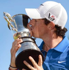 Rory McIlroy of Northern Ireland kisses the Stonehaven trophy after winning the Australian Open golf tournament played at the Royal Sydney course in Sydney. AFP PHOTO