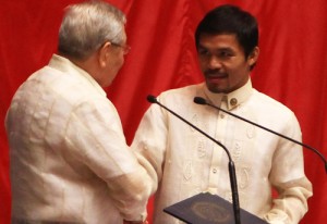 Sarangani Rep. Manny Pacquiao receives a commendation from the House of Representatives for his victory over American Brandon Rios. The boxing champ was lauded by his peers amid reports he still has tax debts in the United States. PHOTO BY MIGUEL DE GUZMAN