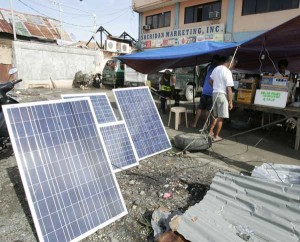 Solar panels on display in front of a store in Leyte. The United Nations High Commissioner for Refugees has distributed solar lamps to 6,000 families living in provinces affected by Super Typhoon Yolanda (Haiyan). PHOTO BY RENE H. DILAN