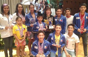 Philippine Swimming League President Susan Papa (fourth from right, standing) with the members of the Philippine contingent to the 2013 Royal Bangkok Sports Club Invitational Swimming Championships. PHOTO BY EMIL C. NOGUERA