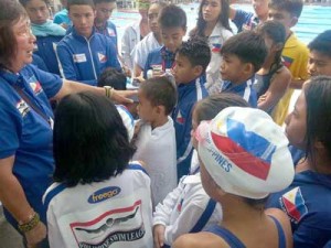 Philippine Swimming League President Susan Papa giving instructions to the swimmers during the 2013 Royal Bangkok Sports Club (RBSC)—Invitational Swimming Championships. CONTRIBUTED PHOTO