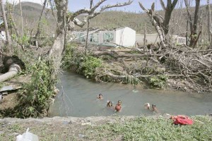 Children have fun swimming on a river in Marabut town in Samar province, one of the areas flattened by super typhoon Yolanda. PHOTO BY RENE H. DILAN