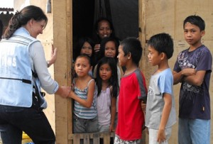 Resident and Humanitarian Coordinator for the Philippines Luiza Carvalho, UN Resident humanitarian coordinator for the Philippines, chats with survivors of typhoon Pablo in Compostella Valley when she visited them in March this year.