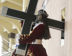 A devotee kisses the image of the Black Nazarene which was transported to the Luneta Grandstand on Monday night. The image will be taken around Manila on Thursday in a procession that is expected to be joined by at least 10 million people.  PHOTO BY RENE H. DILAN