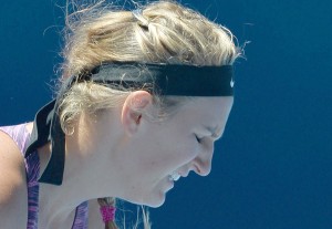 Belarus’ Victoria Azarenka reacts during her women’s singles match against Poland’s Agnieszka Radwanska on day ten of the 2014 Australian Open tennis tournament in Melbourne. AFP PHOTO