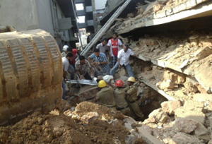 Rescue workers pull a victim from the rubble of a collapsed building under construction in Canacona, about 80 kilometers from the capital Panaji of western Goa state on Saturday. AFP PHOTO