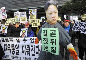 South Korean conservative activists denounced in effigies North Korean leader Kim Jong-Un (right) during an anti-North Korea rally marking the birthday of Kim in Seoul on Wednesday. AFP PHOTO