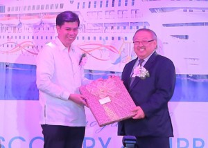 Tourism Assistant Secretary Benito C. Bengzon Jr. (left) hands over a memento to ‘Star Cruises’ Chief Operating Officer Willam Ng