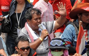 A file photo taken on April 28, 2010 shows Kwanchai Praipana (center) speaking on a microphone during “Red Shirt” anti-government protests in central Bangkok. AFP PHOTO