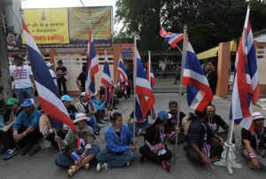 Anti-government protesters gather outside a polling station in a bid to prevent people from voting in Narathiwat, southern Thailand on Sunday. AFP PHOTO