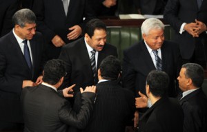 Justice Minister Hafedh Ben Salah (right), Interior Minister Lotfi Ben Jeddou (center) and newly nominated Defense Minister Ghazi Jeribi (left) greet Tunisian deputies as they attend a parliamentary session in which Jomaa presented his new government in the Constituent Assembly on Tuesday (Wednesday in Manila) in Tunis. AFP PHOTO