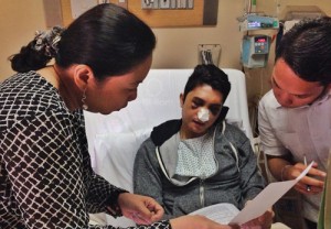 Actor and TV host Vhong Navarro reviews his sworn statement against his attackers in his hospital bed hours before the National Bureau of Investigation filed criminal charges against businessman Cedric Lee, Deniece Cornejo and several others at the Department of Justice.  Photo courtesy of ABS-CBN 