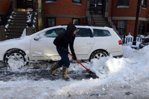 A woman shovels her car out from snow on East Concord Street after a two-day winter storm in Boston, Massachusetts on Saturday (Sunday in Manila). The storm began mid day Thursday with heavy snows overnight into Friday bringing with it extreme cold. AFP PHOTO