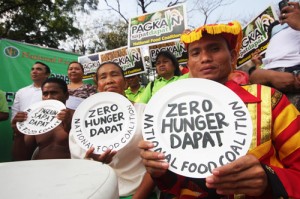  Members of indigenous groups join farmers at a rally held in front of the House of Representatives building in Quezon City to show support to a measure that seeks to ensure adequate food and end hunger. Photo By Miguel De Guzman 