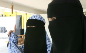 Clad in masturah and najib veils, Fil-Algerian sisters Nadjoua and Linda Bansil meet the press at a military camp in Zamboanga City. The documentary film makers were kidnapped by Muslim extremists and held for eight months before they were finally recovered by the military on Friday. AFP PHOTO 