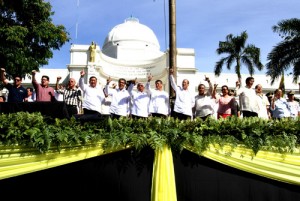 President Benigno Aquino 3rd flashes the Laban sign along with other officials during rites to commemorate the 28th anniversary of the Edsa People Power Revolt in Leyte on Tuesday. The President skipped Edsa rites in Manila and toured areas devastated by calamities instead. Malacañang photo