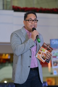  Eats 2014 editor Anton Diaz holds a copy of the resto guide 