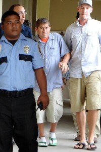 Jose Salvador Alvarenga (center) of El Salvador arrives at a press conference in Majuro on Thursday. AFP PHOTO