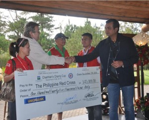 CJH Golf Club chairman Robert John L. Sobrepeña shakes hands with Philippine Red Cross Baguio Chapter director Peter Go at the turnover of a check donation to help typhoon-ravaged Central Visayas 