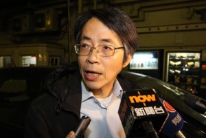 Kevin Lau, former editor of the Ming Pao newspaper, speaking to the media outside the Ming Pao Building in the Chai Wan district of Hong Kong island.  AFP PHOTO