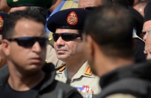A file photo taken on September 20, 2013 shows Egypt’s army chief Abdel Fattah al-Sisi (center) attending a military funeral in the district of Giza, on the outskirts of Cairo. AFP PHOTO