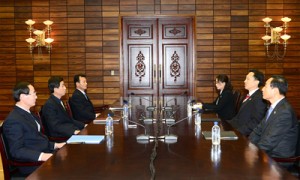 South Korea’s working-level delegation head Lee Duk-Haeng (second from right) talks with his North Korean counterpart Park Yong-Il (second from left) during a meeting on resuming reunions for families separated by the Korean War, at the truce village of Panmunjom on Wednesday. AFP PHOTO