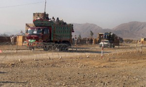 Pakistani tribal families crossing a military check post as they flee after airstrikes on Taliban hideouts, at the exit point of Saidgi village, in the tribal district of North Waziristan on Tuesday. AF PHOTO