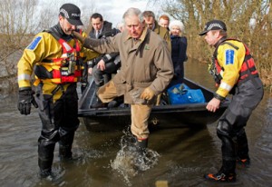 Britain’s Prince Charles, Prince of Wales, steps off a boat with the help of police as he arrives at the flood-hit village of Muchelney in Somerset, southwestern England on Tuesday (Wednesday in Manila). AFP PHOTO