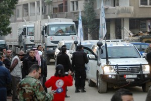 A handout picture released by the official Syrian Arab News Agency on Saturday (Sunday in Manila), allegedly shows a convoy of United Nations and Syrian Red Crescent vehicles waiting to enter the regime-held areas of the Syrian city of Homs. AFP PHOTO