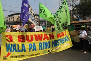 Activists march to Mendiola during the third month commemoration of the devastation brought by Super Typhoon Yolanda.