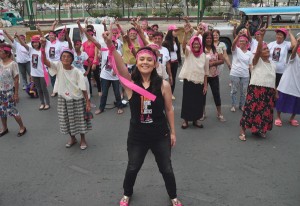 Stage actress and activist Monique Wilson performs a dance protest along with members of Lola Pilipina in front of the Japanese embassy in Pasay City on Wednesday. Despite their advanced age, the Filipino women who served as comfort women for Japanese forces during World War II participated in the protest action as part of One Billion Rising for Justice Philippines, which seeks just compensation for the victims. PHOTO BY EDWIN MULI