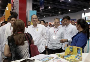President Benigno Aquino 3rd is escorted by Philippine Travel Agencies Association executive director Marciano Ragaza III as he visits the Travel Tour Expo 2014 at the SMC Convention Center, Seashell Drive, Mall of Asia in Pasay City. MALACAÑANG PHOTO