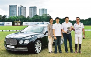 Bentley Flying Spur, Manila Polo field, serve as picturesque backdrop for (from left) Enrique Zobel Foundation Chairman Dee Zobel, PGA Cars Directors Roberto Coyiuto 3rd and Benedicto Coyiuto, and Enrique Zobel Foundation Chief Executive Officer Iñigo Z