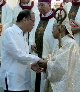President Benigno Aquino 3rd greets Orlando Cardinal Quevedo after the thanksgiving Mass at the Immaculate Conception Cathedral in Cotabato City in celebration of Quevedo’s elevation to the College of Cardinals.  MALACAÑANG PHOTO 