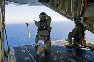   Crewmen of a Royal Australian Air Force plane prepare to launch a self locating data marker buoy into the southern Indian Ocean as part of efforts to find the missing Malaysian Airline jetliner.   The search enters its second week today. AFP photo 